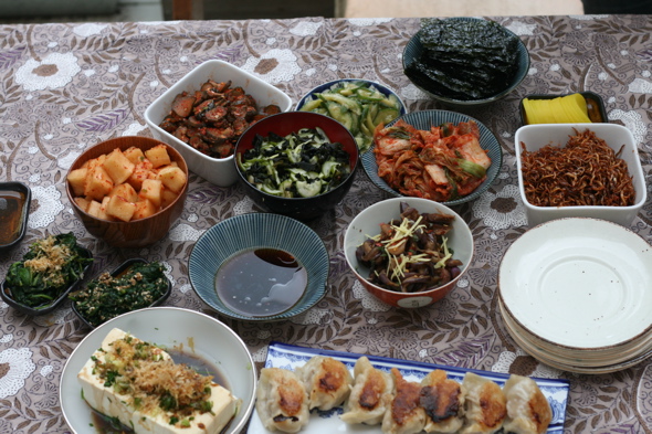 Korean BBQ side dishes, gyoza, tofu, tsukemono, pickles